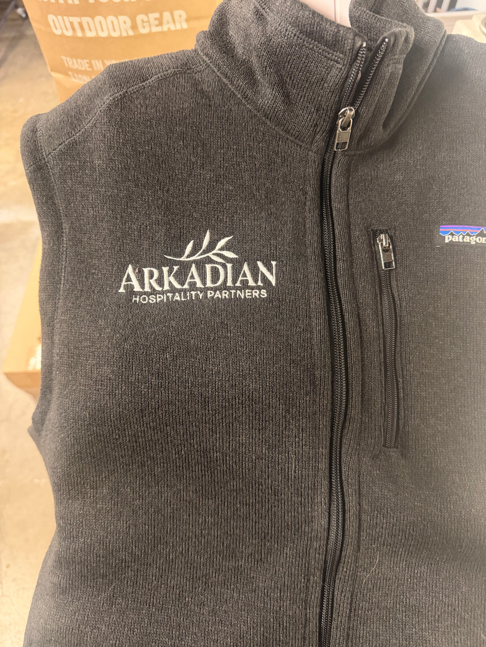Charcoal quarter-zip with white embroidered chest logo